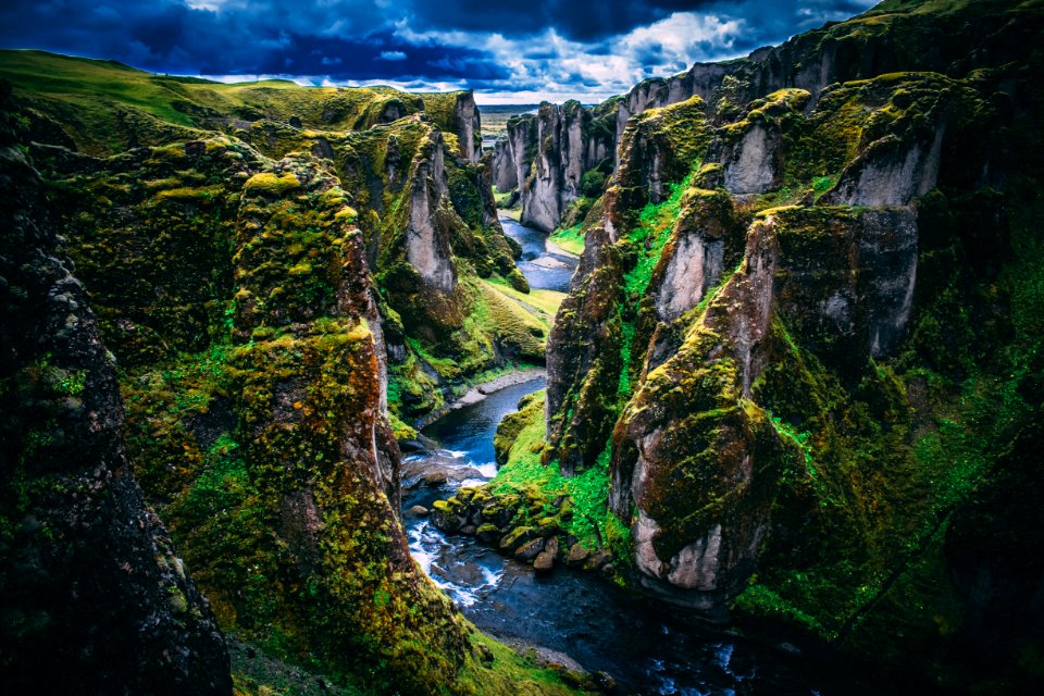 Photography Of Mountains Under Cloudy Skies