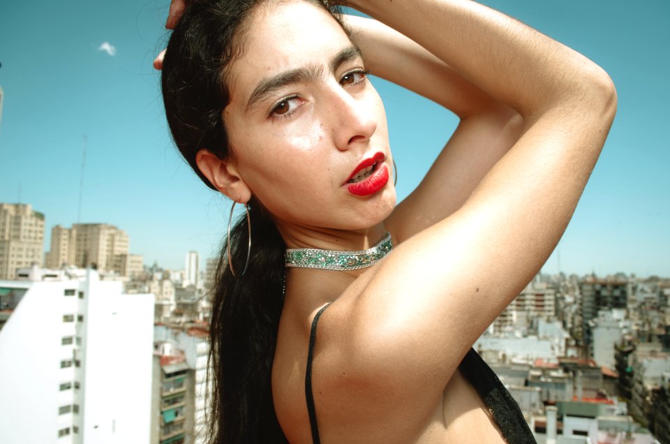 Woman Wearing Spaghetti-strap Top With Two Hands On Head