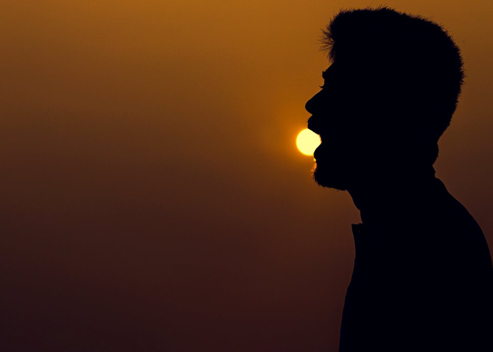 Silhouette Of Man Over The Horizon