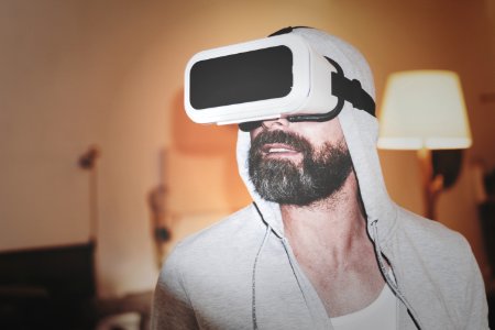 Man Wearing Gray Hoodie And White Virtual-reality Headset photo