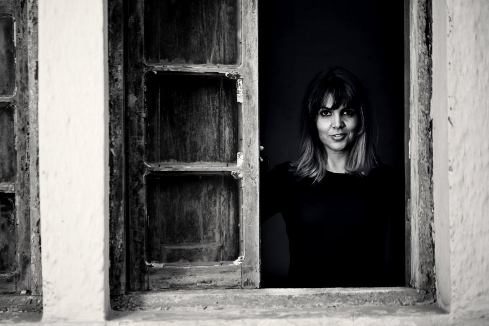 Gray Scale Photo Of Woman In Window