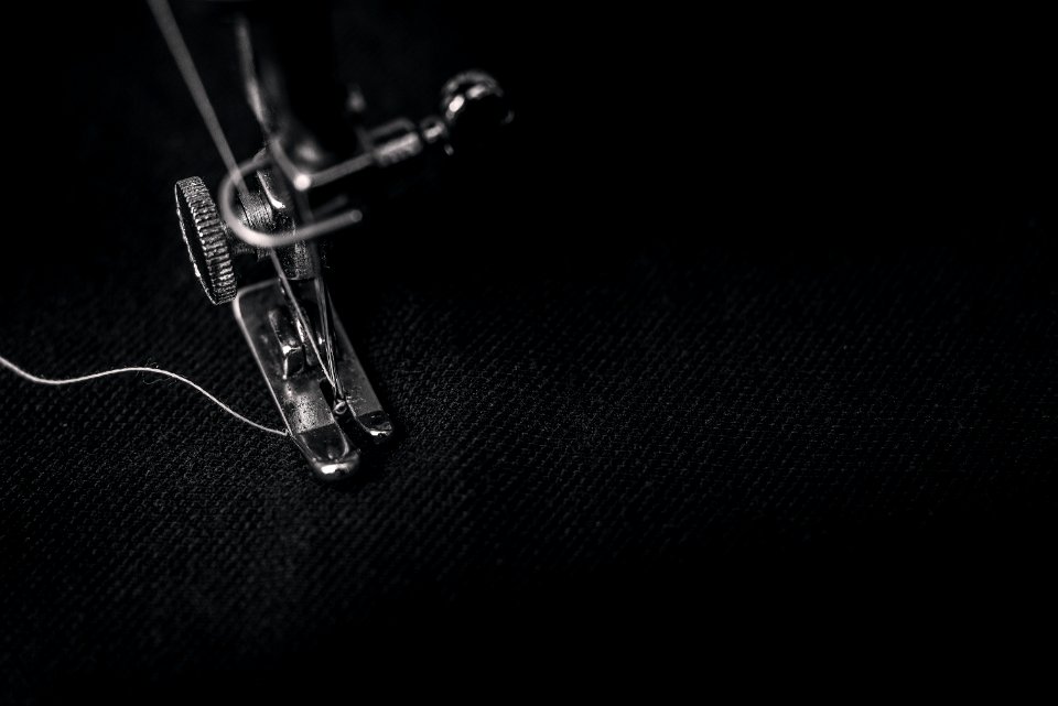 Closeup Photography Of Presser Foot Of Sewing Machine