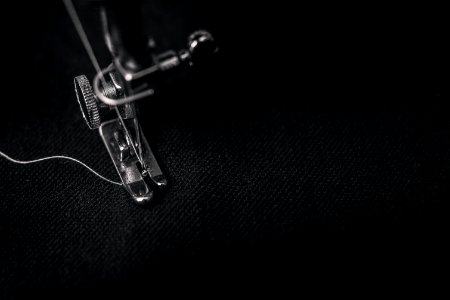 Closeup Photography Of Presser Foot Of Sewing Machine