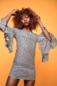Woman Wearing White And Black Checkered 34 Sleeved Shirt