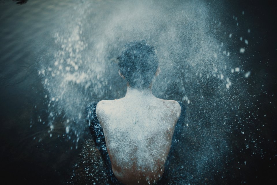 Person Splashing Powder On His Back