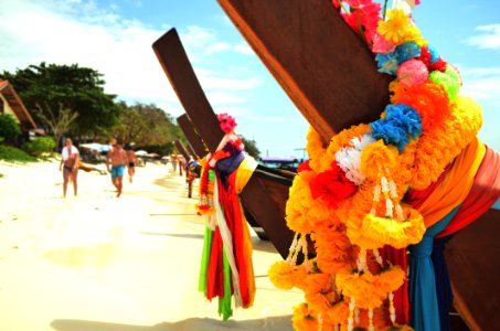 Closeup Photo Of Brown Wooden Fence With Multi-colored Fabric Tie photo