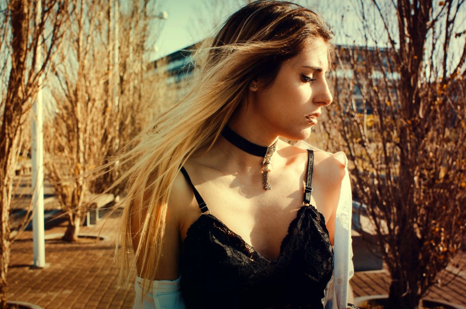 Woman Wearing Black Choker And Sleeveless Top Walking On Street