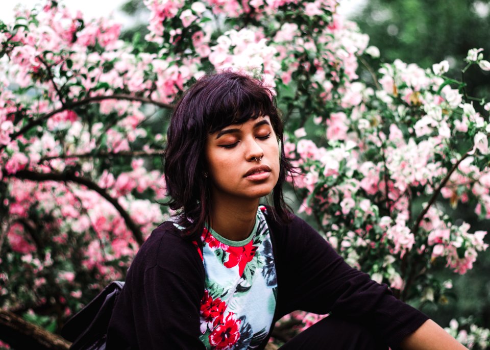 Woman Wearing White And Red Floral Crew-neck Shirt Near Pink Petaled Plant
