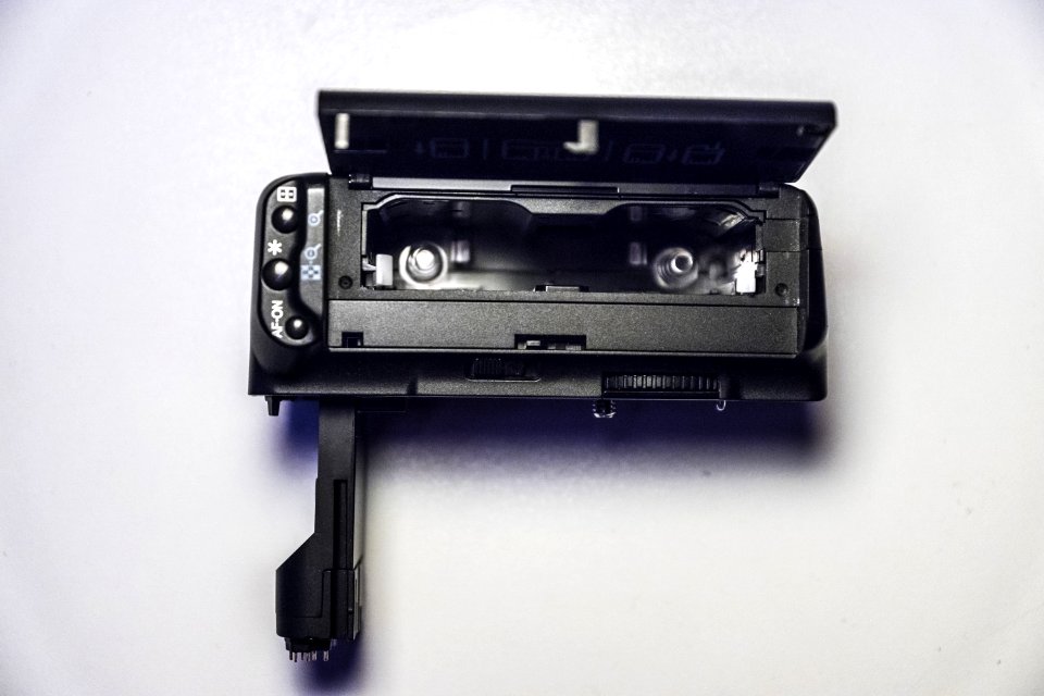 Black Compact Camera On White Surface