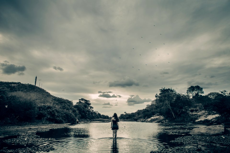 Grayscale Photo Of Female On Body Of Water