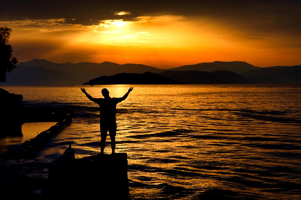 Silhouette Photo Of Person Standing Near Beach