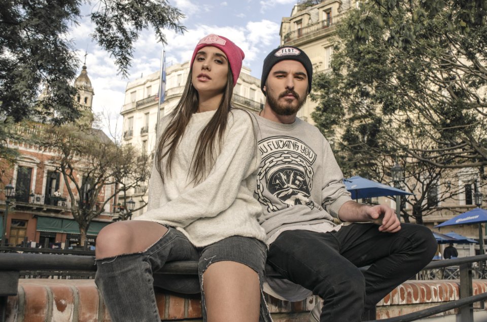Couple Sitting On Raillings