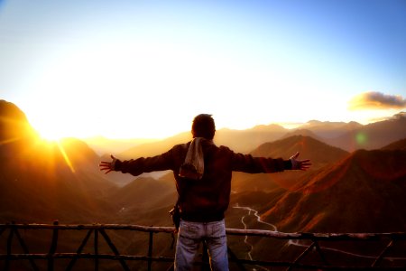 Man In Black Jacket Standing Near Sunset photo