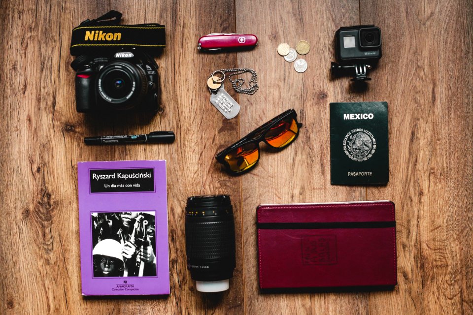 Black Nikon Dslr Camera Gopro Hero Session And Black Framed Sunglasses