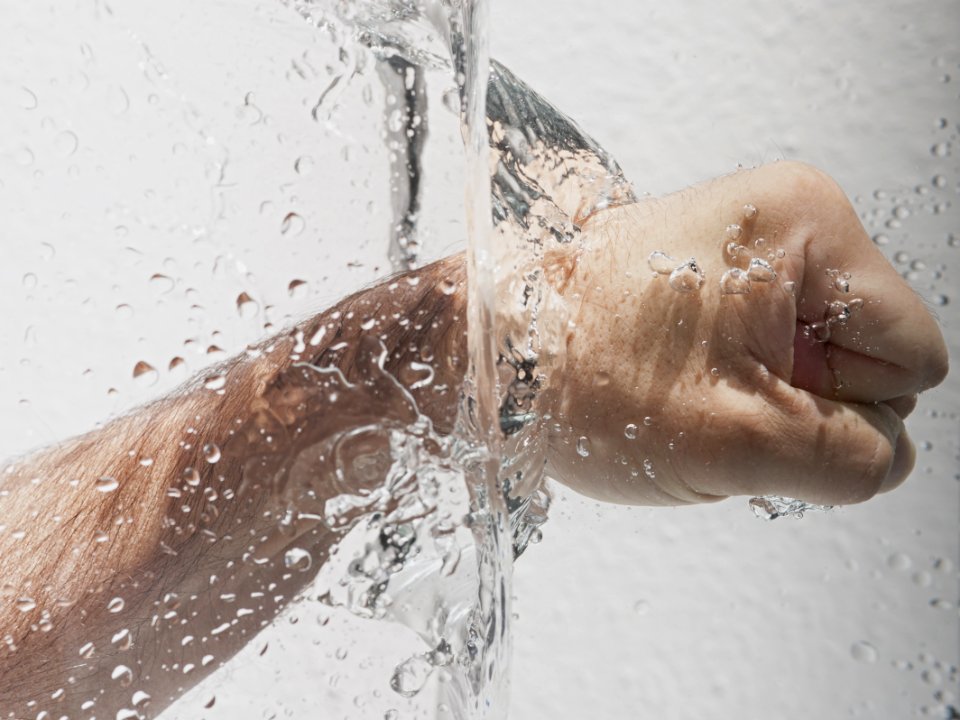Persons Left Fist Punching Water