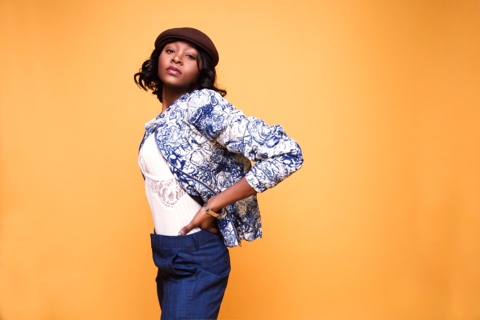 Woman Wearing White Shirt And Blue And White Jacket