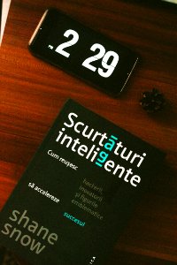Black Android Smartphone Beside Scurtaturi Inteligente Book
