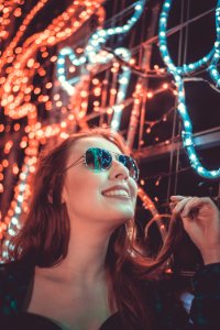 Woman Wearing Sunglasses Holding Her Hair photo