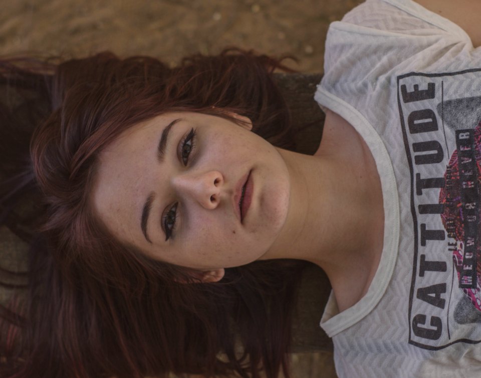Woman Wearing White And Black Cattitude-printed Shirt