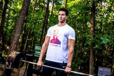 Photo Of Man Holding Barbell photo