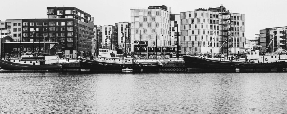 Grayscale Photography Of Buildings And River photo