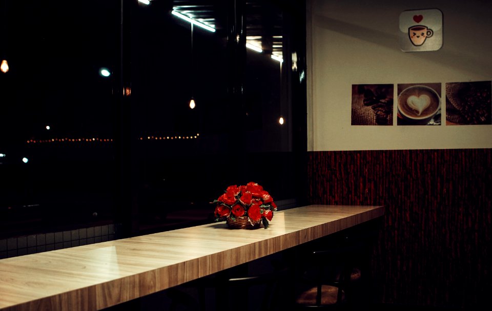 Red Rose Arrangement Decor On Brown Wooden Desk