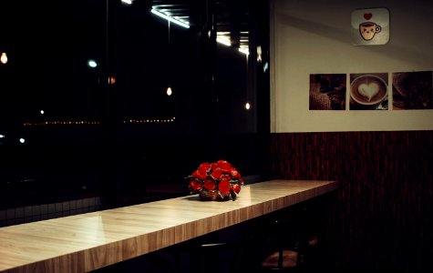 Red Rose Arrangement Decor On Brown Wooden Desk