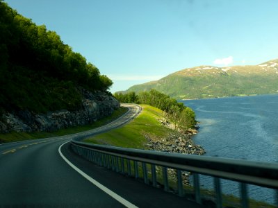 Concrete Road Near Body Of Water photo