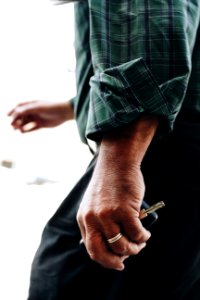 Person Holding A Silver-colored Key