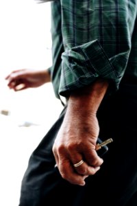 Person Holding A Silver-colored Key photo