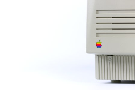 Gray Device With Apple Logo On White Surface photo