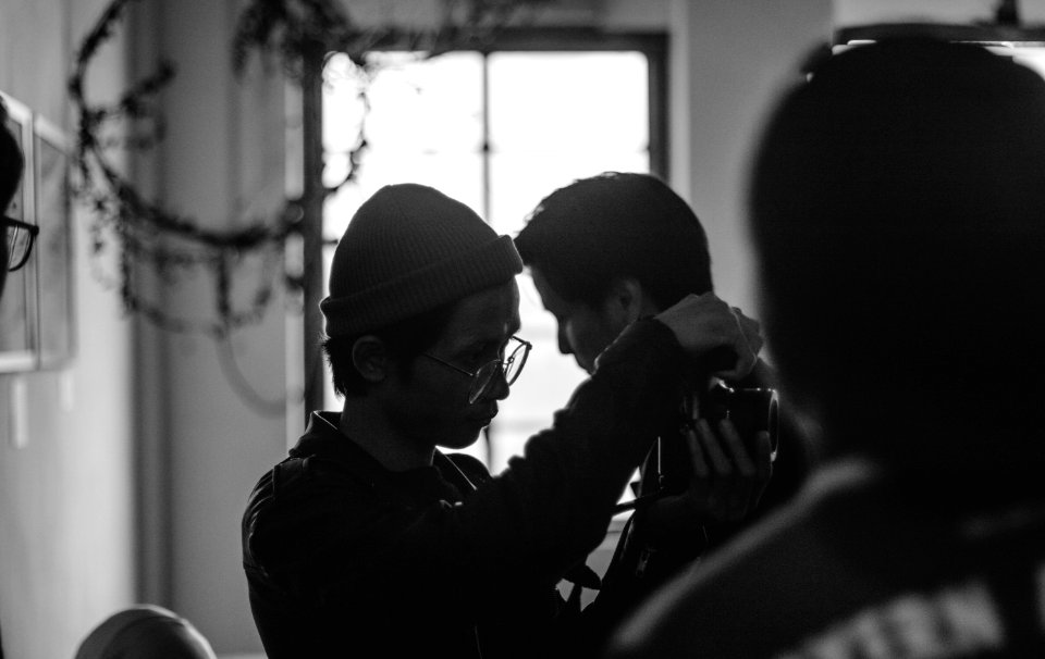 Grayscale Photo Of Man Holding Mans Neck