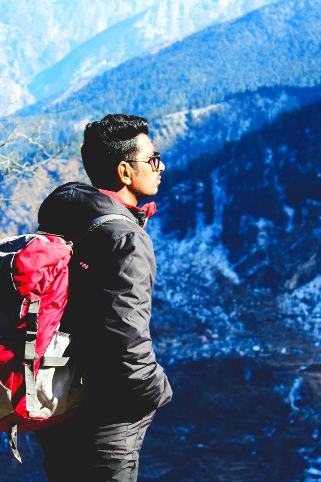 Man In Black Jacket Taking Selfie On Top Of Mountain