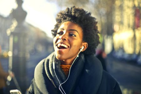 Close-up Photo Of A Woman Listening To Music photo