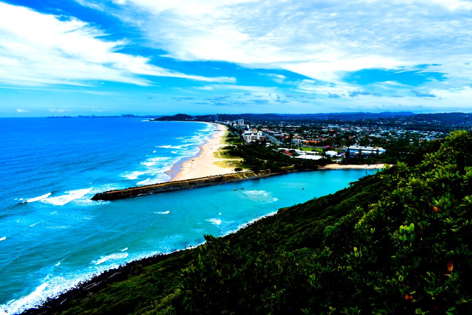 Blue Ocean Near Trees And Mountains Photo