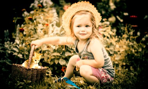 Photo Of Girl Playing With Kitten