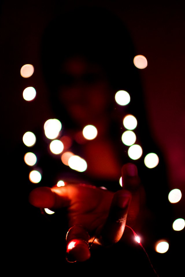 Close-Up Photography Of Hand With Lights