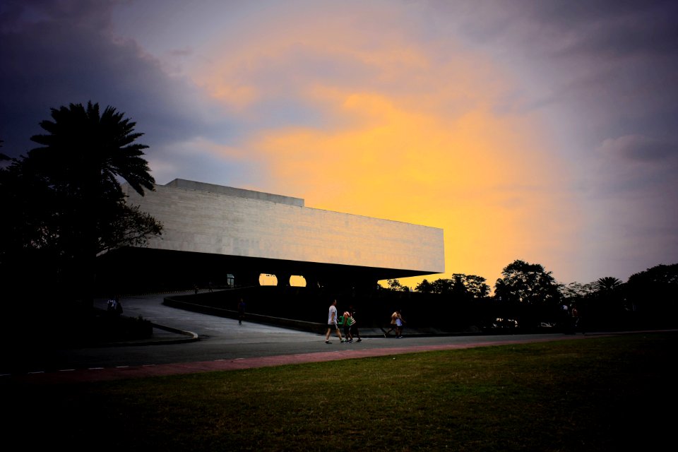 People Walking Near White Concrete Structure photo