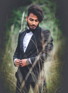Photography Of A Man Wearing Black Suit photo