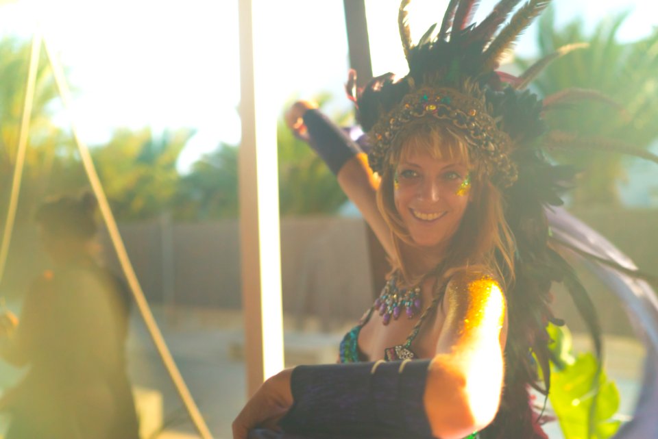 Woman Wearing Blue Spaghetti-strap Top With Feather Headdress