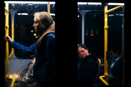 Photo Of A Woman Standing Inside Bus