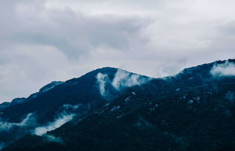 Photography Of Mountain Under Cloudy Sky