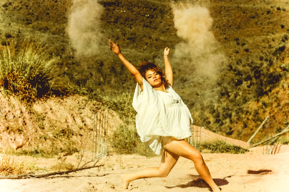 Woman In White Dress Dancing