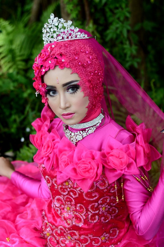 Woman Wears Pink Long-sleeved Dress With Crown