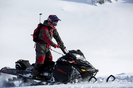 Person Riding On Snowmobile photo