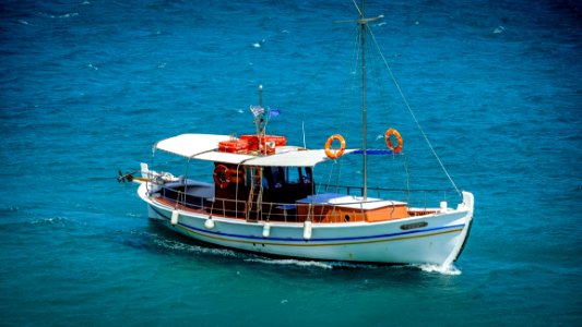 White Sail Boat On Sea