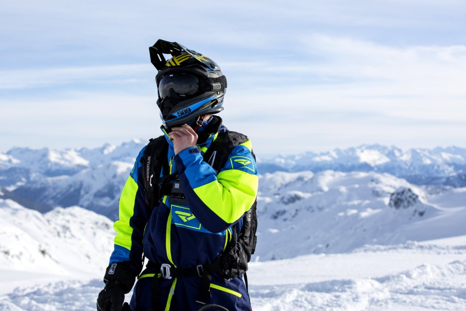 Man In Green And Blue Jacket Standing On Winter Season