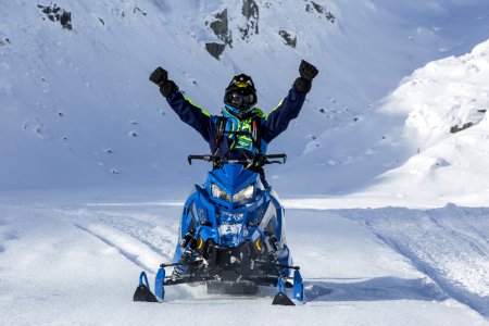 Person Riding Blue Snow Mobile photo