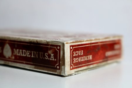 Close-Up Photography Of Dirty Playing Card Box photo