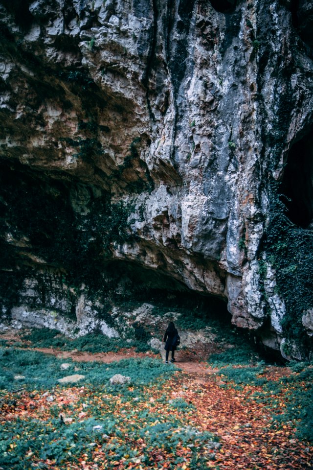 Woman Wearing Black Coat Standing Near Gray Mountain